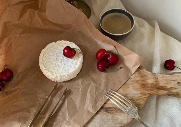 Cheese and cherries on a permanent paper